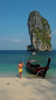 European Men on Tropical Beach in Thailand White Tropical Beach of Koh Poda Thailand