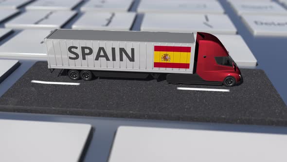 Flag of Spain on Moving Truck and Computer Keyboard