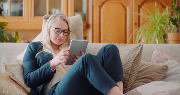 Businesswoman Using Digital Tablet In Office