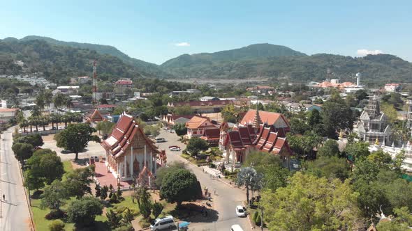 Wide Panoramic of Wat Chalong temple grounds on a hot sunny day in Phuket, Thailand 