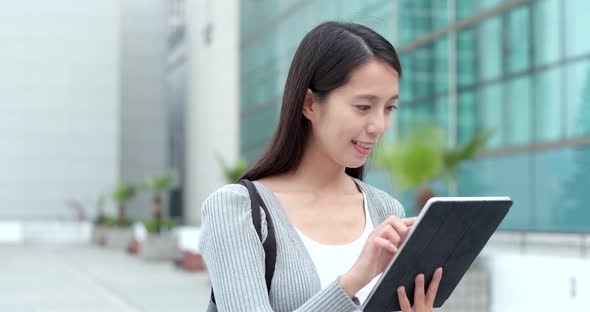 Woman working on tablet computer