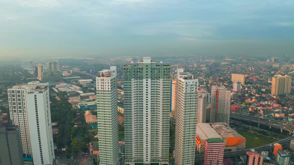 Modern Building Sunrise Skyline Background in Manila City, Philippines 