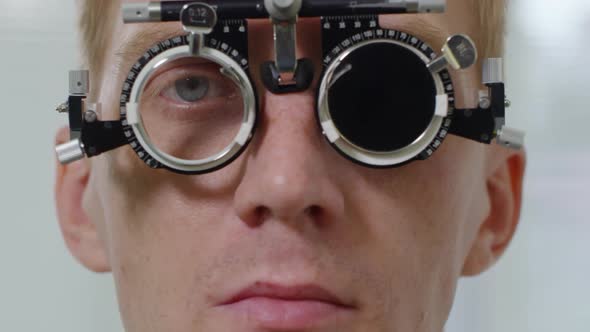 Man Wearing Trial Frame during Eye Exam