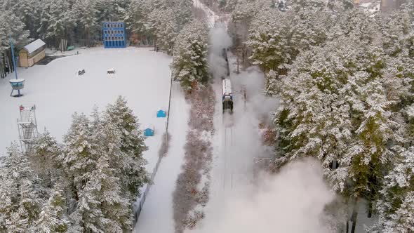 Aerial View of Vintage Steam Engine Train Puffing Smoke