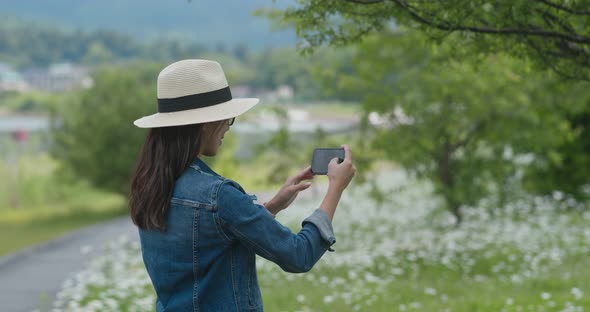 Woman Take Photo with Cellphone in Countryside
