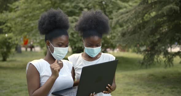 Two Black Girls Students with Laptop in Park