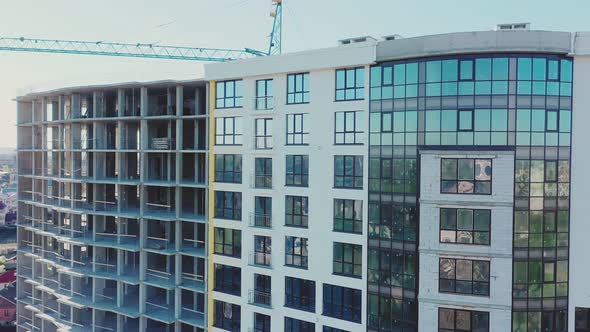 Construction site with monolith frames of new multi story buildings in fast-growing city