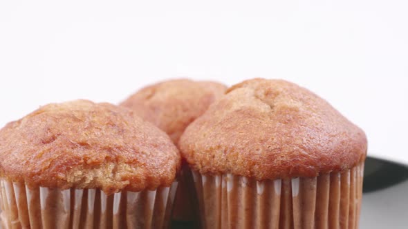 Muffins banana with white background shallow focus and slowly rotating.