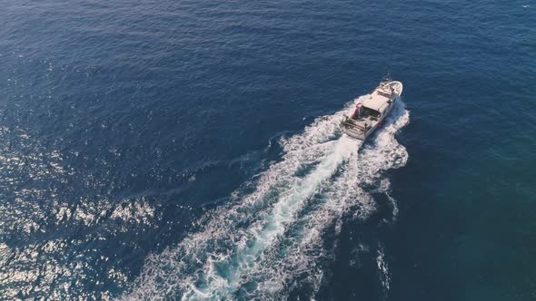 Modern boat sailing in rippling sea