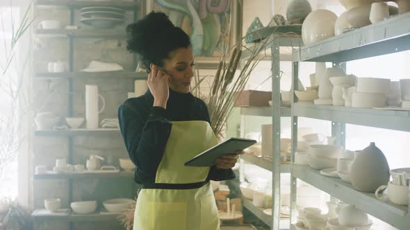 Woman Shop Assistant Is Making Order