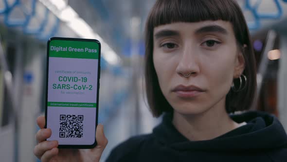 Woman Showing Digital Green Pass on Cell Phone After Vaccine