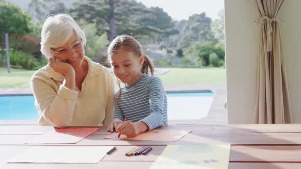 Grandmother and little girl drawing together 4K 4k