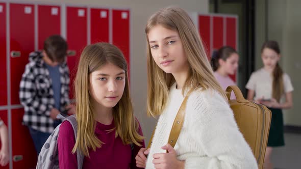 Video portrait of schoolgirls standing in school corridor. Shot with RED helium camera in 8K.