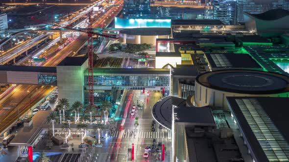 Aerial View of Shopping Mall with Financial Center Road Night Timelapse