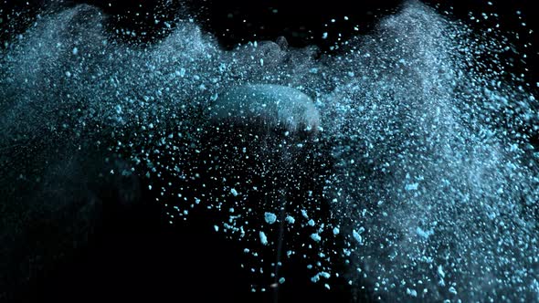 Super Slow Motion Shot of Blue Powder Falling From Facial Brush at 1000Fps