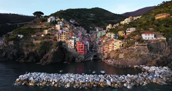 Alluring and charming Riomaggiore on dramatic steep mountainside; aerial