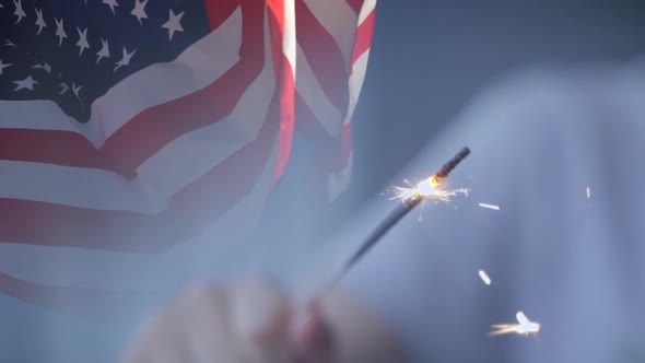 USA Flag Waving and Kid Playing with a Sparkler in Slow Motion