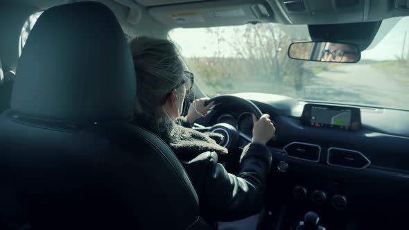 Woman Driver Hand On Car Steering Wheels. Using Windshield Wiper And  Car Wheel. Travel Driving Auto