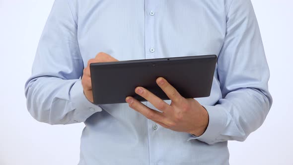 A Man Works on a Tablet - Front Closeup - White Screen Studio