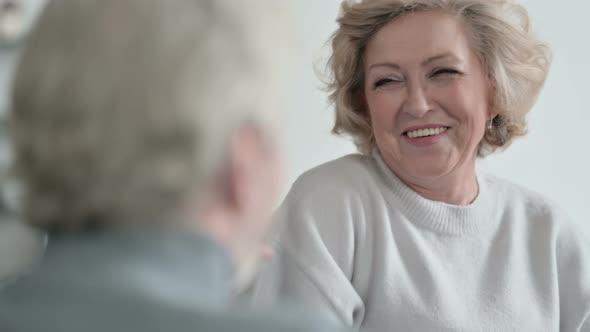 Old Man Talking To Happy Old Woman