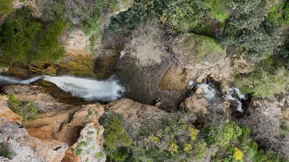 Waterfall in the mountains aerial view 4 K