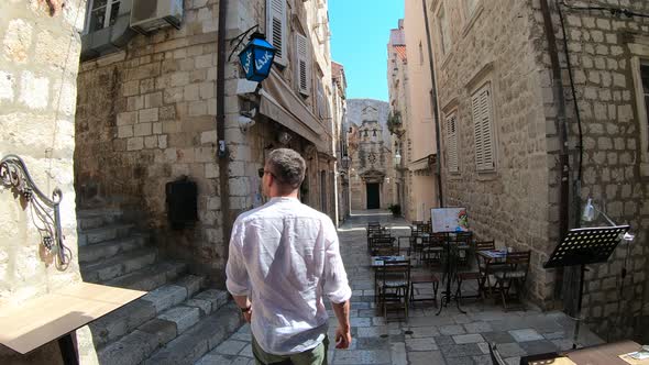 Man walking on the streets of Dubrovnik Old Town, Croatia