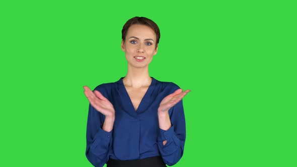 Smiling Beautiful Business Woman Clapping Hands on a Green Screen, Chroma Key.