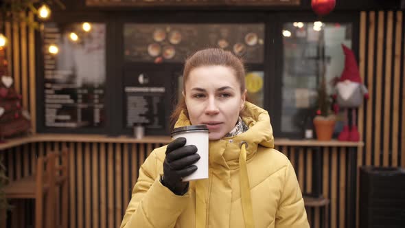 Portrait of Young Woman Drinking Take Away Coffee