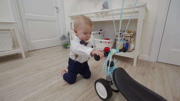 Kid on Baby Bicycle Balance Bike for Toddlers with Colorful Balloons 1 Year Old Baby Boy Celebrating