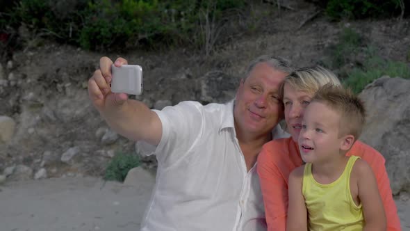 Grandparents and Grandson Taking Mobile Selfie