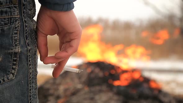 Farmer Burning Stack of Dry Reed