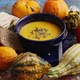 Vegetarian Autumn Pumpkin Cream Soup with Seeds and Colorful Various Mini Pumpkins Around - VideoHive Item for Sale