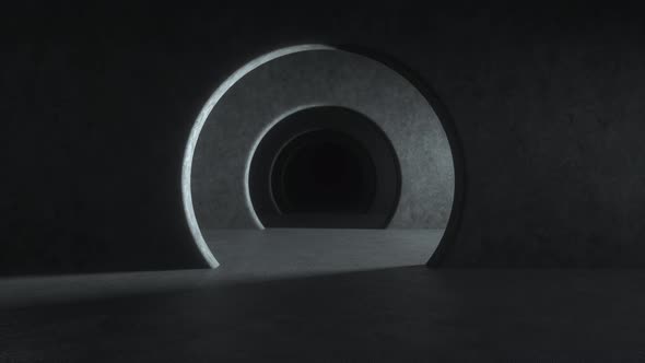 Gray concrete tunnel with dramatic light