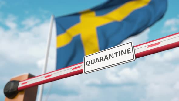 Opening Boom Barrier with QUARANTINE Sign Against the Swedish Flag