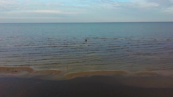 Fisherman Catches Flounder in the Kolka Cape, Baltic Sea, Latvia.