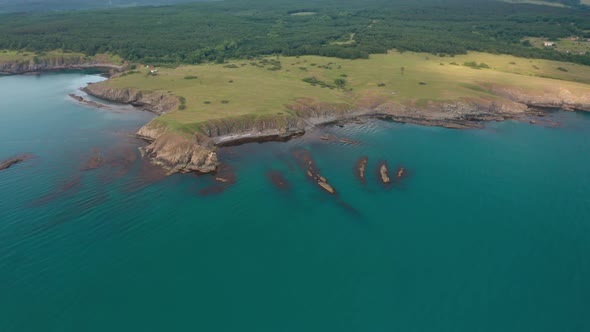 Drone flight around a picturesque rocky coastline