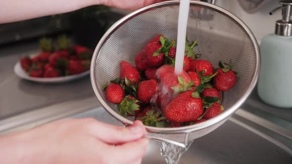 Closeup of Washing Strawberries