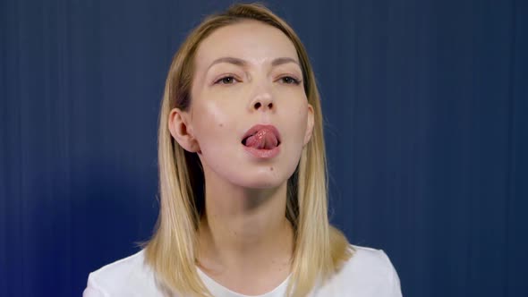 Anti-wrinkle Facial Exercises, Woman Is Showing, Stretching Tongue Up for Tensing Muscles