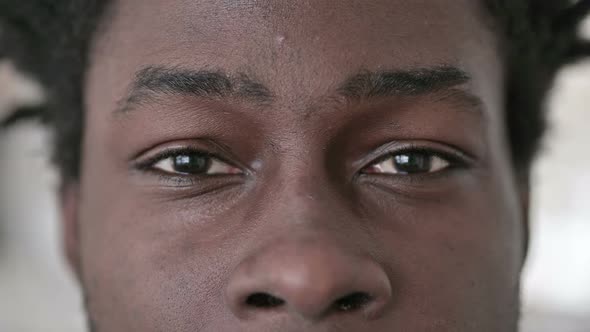 Close Up of Blinking Eyes of African Man