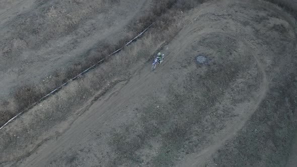 Aerial view of a motocross rider on a dirt track