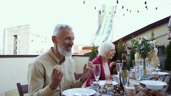 Family and friends having dinner together