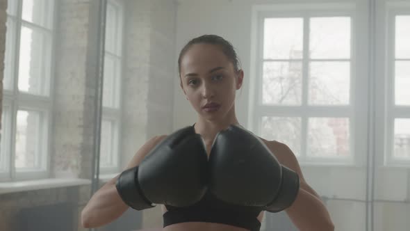 Portrait Of Attractive Female Boxer In Gloves