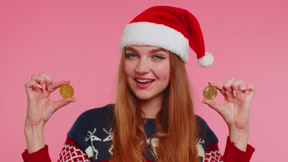 Girl in Christmas Sweater Showing Golden Bitcoins BTC Cryptocurrency Money Investment Mining Future