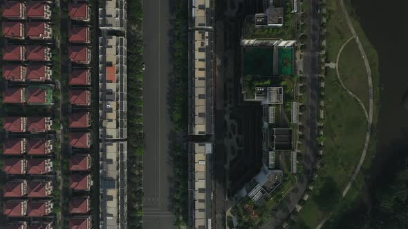 Top down aerial view of ultra modern lakeside housing and apartment development on a sunny day with