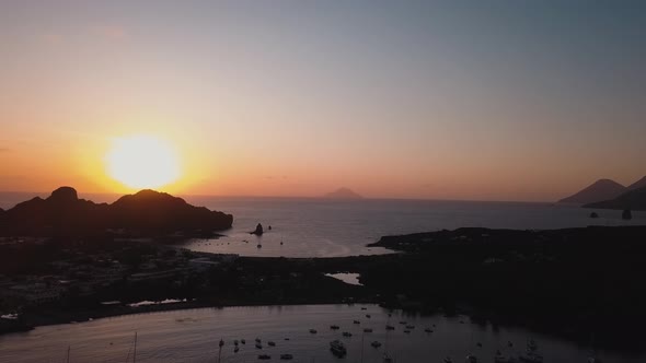 Aerial View on Lipari Islands with Trees, Buildings and Mountains. Moored Vessels. Mediterranean Sea