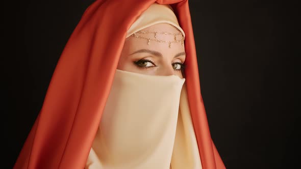 Close Up Portrait Of Beauty Young Muslim Woman In Hijab Looking At Camera.