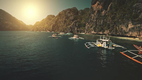 Seascape with Passenger Boats at Sunset in Closeup Aerial View