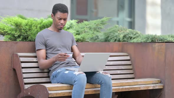 Unsuccessful Online Payment on Laptop By Young African Man