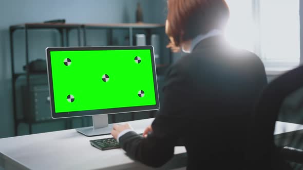 Business Woman Looking at Chroma Key Screen