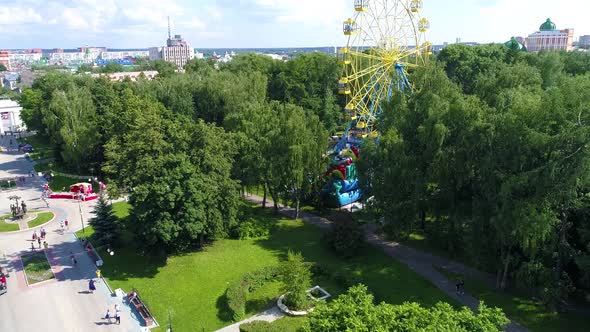 Town square in the park in summer cloudly day - Drone Footage